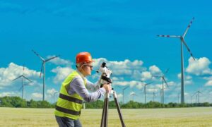Iowa wind turbine lease - ALTA SURVEY Iowa Land surveyor measuring farmland near wind turbines in Iowa before a proposed wind lease