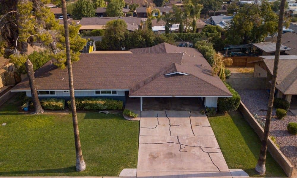 Aerial view of a residential driveway and surrounding property to help find property lines before expansion